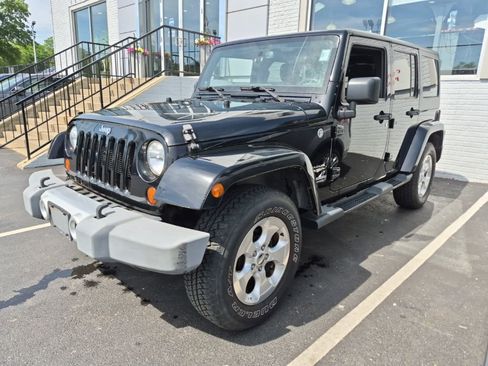 Used 2013 Jeep Wrangler Unlimited Sahara w/ Dual Top Group AWD/4WD image 2