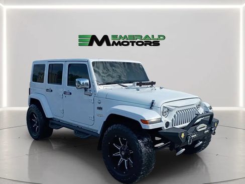 Used 2014 Jeep Wrangler Unlimited Sahara w/ Dual Top Group AWD/4WD image 1