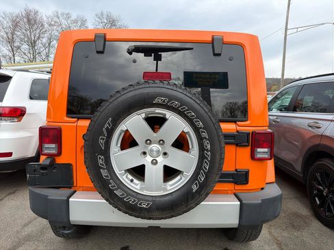 Used 2012 Jeep Wrangler Unlimited Sahara w/ Dual Top Group AWD/4WD image 7