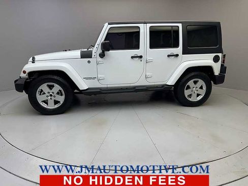 Used 2013 Jeep Wrangler Unlimited Sahara w/ Dual Top Group AWD/4WD image 2
