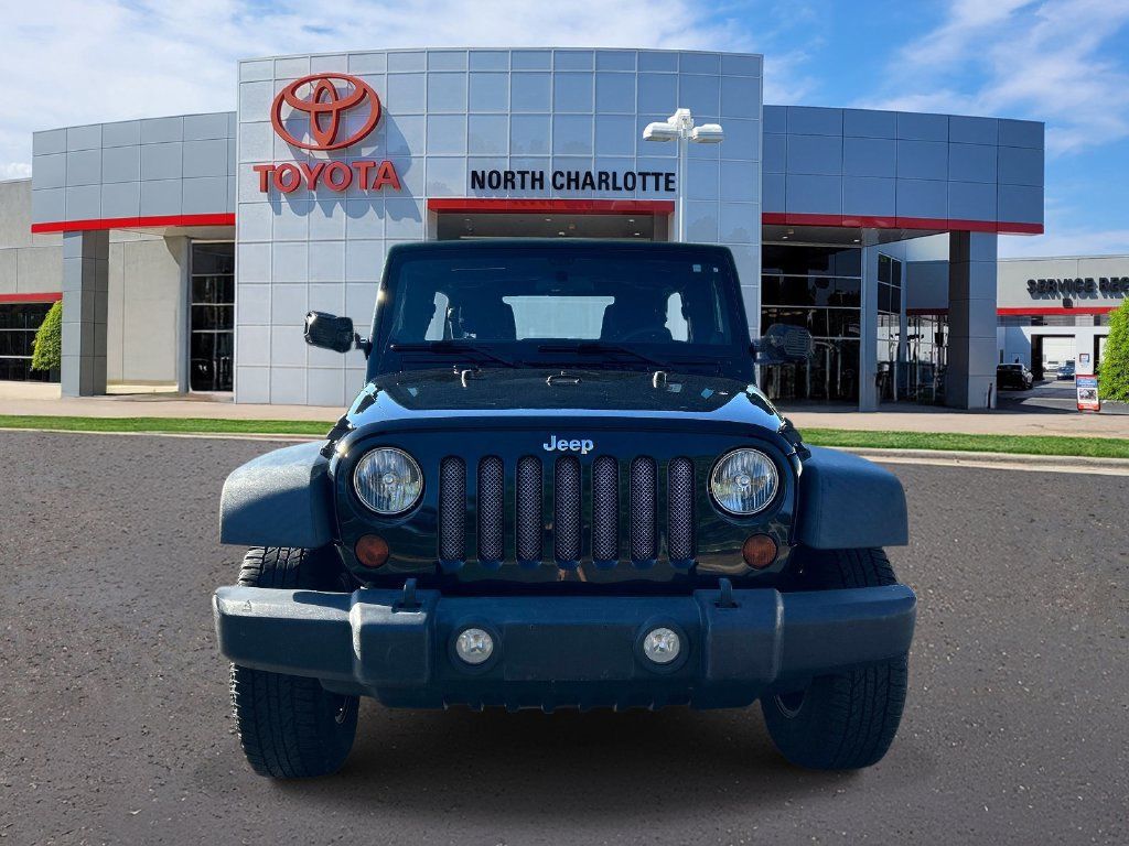 Used 2011 Jeep Wrangler Unlimited Sport w/ Trailer Tow Group AWD/4WD image 2
