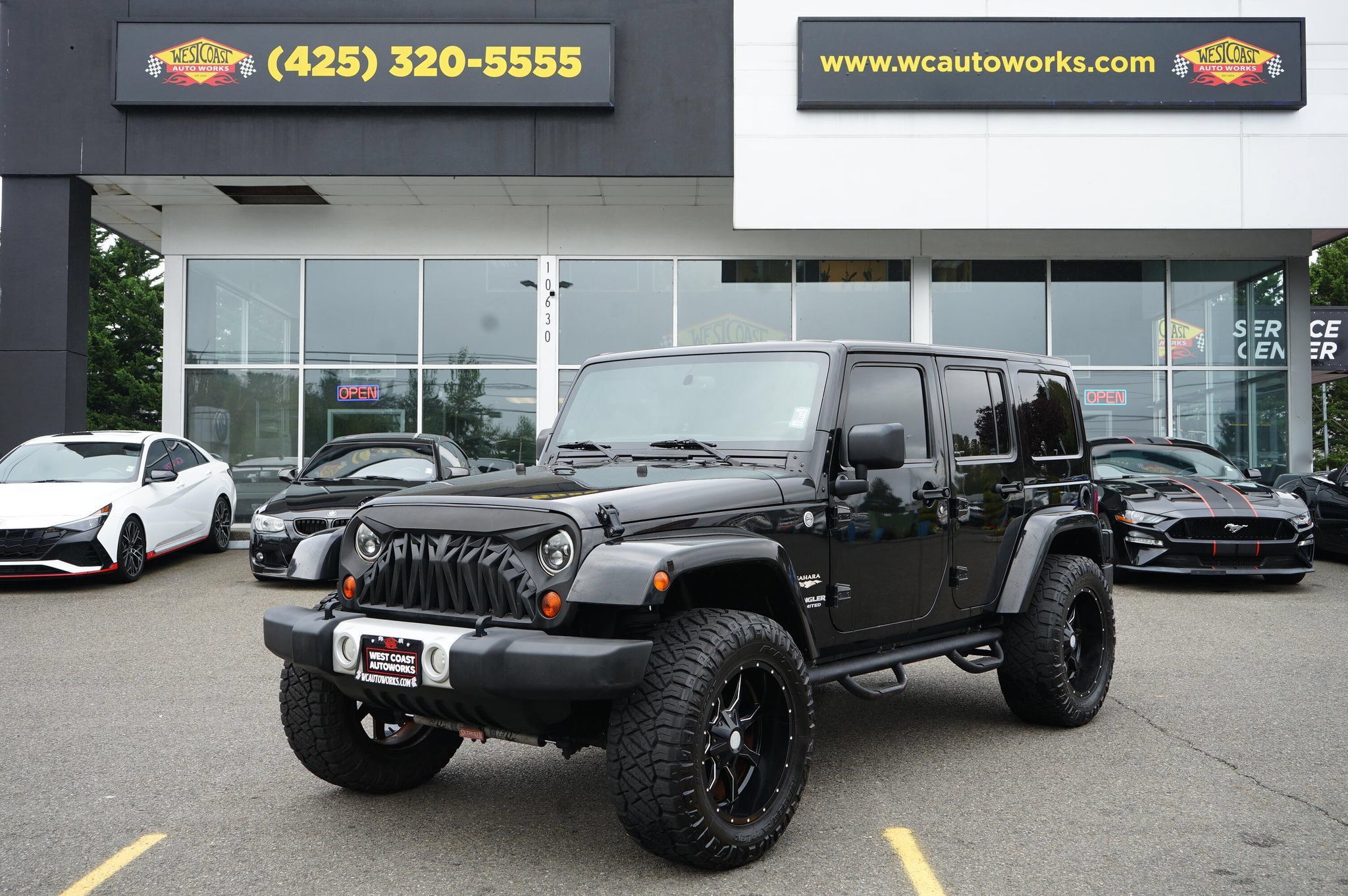 Used 2013 Jeep Wrangler Unlimited Sahara w/ Dual Top Group AWD/4WD image 1