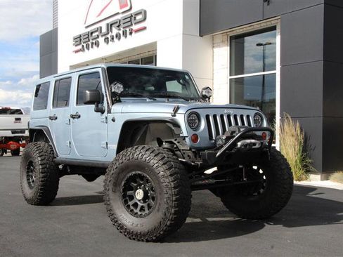 Used 2012 Jeep Wrangler Unlimited Rubicon w/ Dual Top Group AWD/4WD image 1
