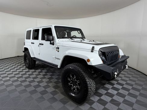 Used 2012 Jeep Wrangler Unlimited Sahara AWD/4WD image 1