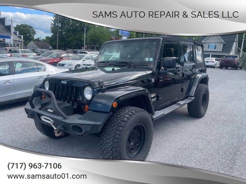 Used 2012 Jeep Wrangler Unlimited Sahara w/ Dual Top Group AWD/4WD image 1