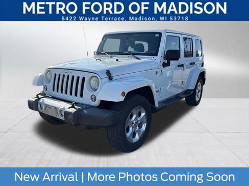 Used 2014 Jeep Wrangler Unlimited Sahara w/ Dual Top Group AWD/4WD image 1