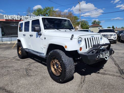 Used 2012 Jeep Wrangler Unlimited Sahara w/ Trailer Tow Group AWD/4WD image 1