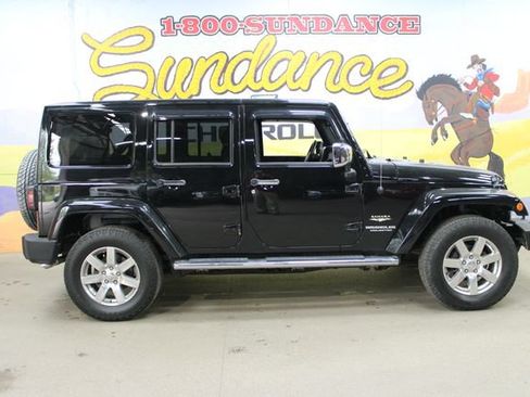 Used 2013 Jeep Wrangler Unlimited Sahara w/ Dual Top Group AWD/4WD image 1