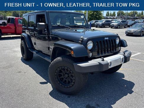 Used 2014 Jeep Wrangler Unlimited Sahara AWD/4WD image 1