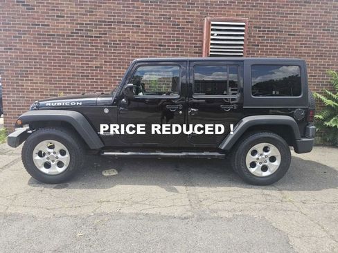 Used 2012 Jeep Wrangler Unlimited Rubicon w/ Dual Top Group image 1