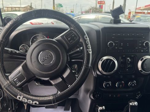 Used 2012 Jeep Wrangler Unlimited Sahara w/ Dual Top Group AWD/4WD image 16