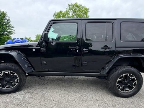 Used 2014 Jeep Wrangler Unlimited Sahara w/ Dual Top Group AWD/4WD image 3