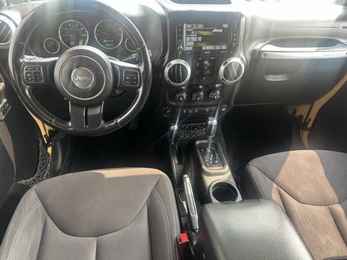 Used 2013 Jeep Wrangler Unlimited Sahara w/ Dual Top Group AWD/4WD image 12