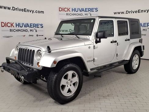 Used 2010 Jeep Wrangler Unlimited Sahara w/ Dual Top Group AWD/4WD image 1