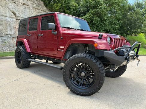 Used 2013 Jeep Wrangler Unlimited Sahara w/ Dual Top Group AWD/4WD image 1
