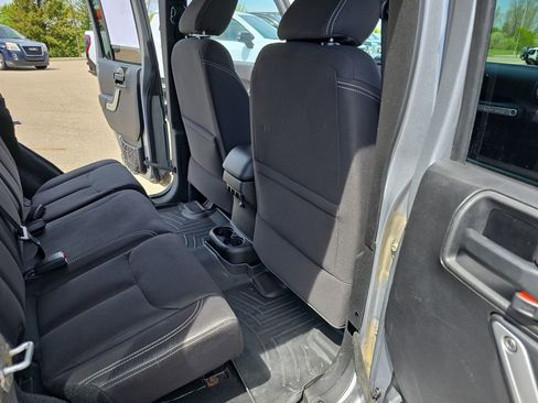 Used 2013 Jeep Wrangler Unlimited Sahara w/ Dual Top Group AWD/4WD image 11