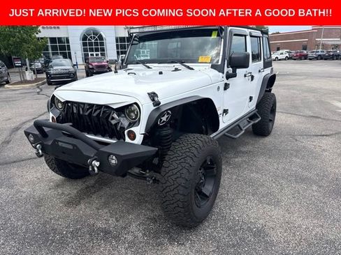 Used 2013 Jeep Wrangler Unlimited Sahara w/ Dual Top Group AWD/4WD image 1