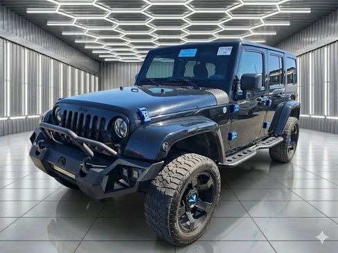 Used 2013 Jeep Wrangler Unlimited Sahara w/ Dual Top Group AWD/4WD image 1