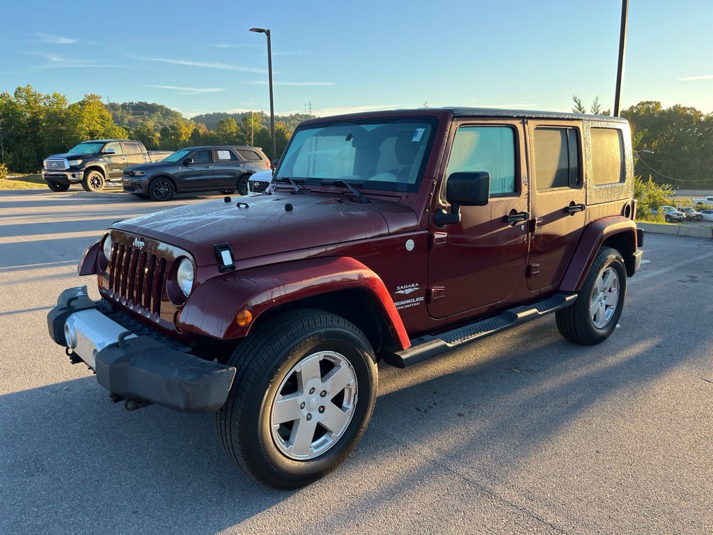 Used 2010 Jeep Wrangler Unlimited Sahara w/ Dual Top Group AWD/4WD image 1