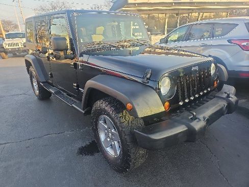 Used 2010 Jeep Wrangler Unlimited Rubicon w/ Dual Top Group image 1