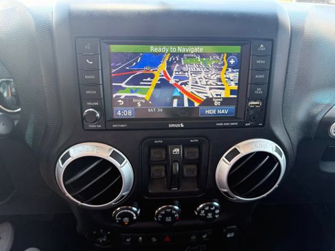 Used 2012 Jeep Wrangler Unlimited Sahara w/ Dual Top Group AWD/4WD image 18