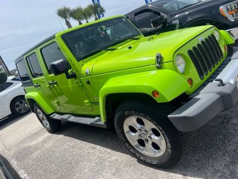 Used 2013 Jeep Wrangler Unlimited Sahara w/ Dual Top Group AWD/4WD image 2