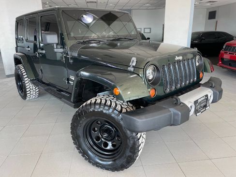 Used 2011 Jeep Wrangler Unlimited Sahara w/ Dual Top Group image 1