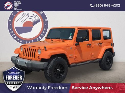 Used 2013 Jeep Wrangler Unlimited Sahara w/ Dual Top Group AWD/4WD image 1