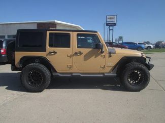Used 2014 Jeep Wrangler Unlimited Sahara w/ Max Tow Package image 1