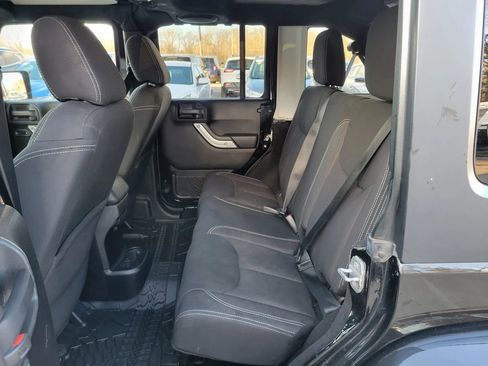 Used 2014 Jeep Wrangler Unlimited Sahara w/ Dual Top Group AWD/4WD image 4