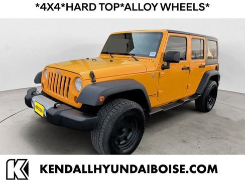 Used 2012 Jeep Wrangler Unlimited Sahara AWD/4WD image 1