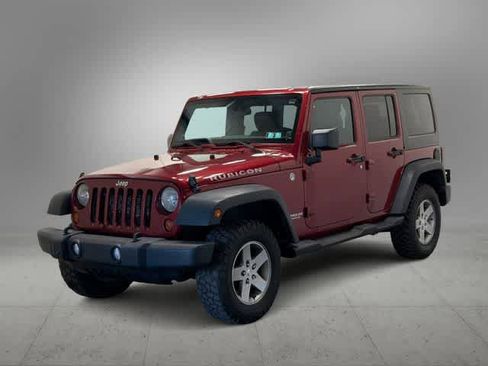 Used 2012 Jeep Wrangler Unlimited Rubicon w/ Dual Top Group AWD/4WD image 1