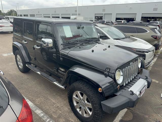 Used 2012 Jeep Wrangler Unlimited Sahara w/ Dual Top Group AWD/4WD image 2