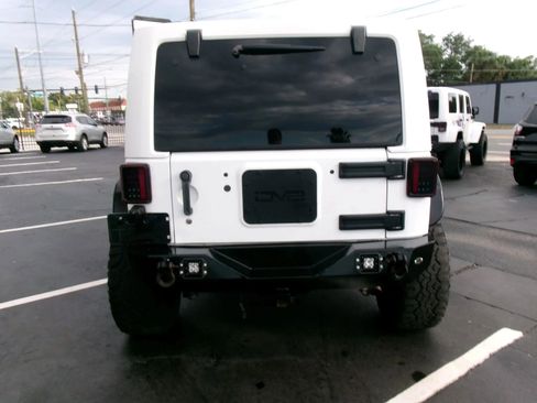 Used 2013 Jeep Wrangler Unlimited Rubicon w/ Dual Top Group AWD/4WD image 4