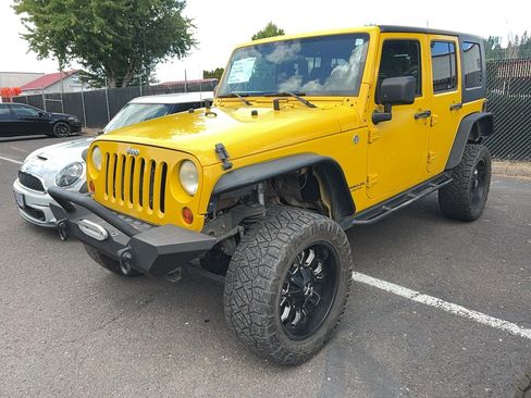 Used 2009 Jeep Wrangler Unlimited Rubicon w/ Dual Top Group AWD/4WD image 1