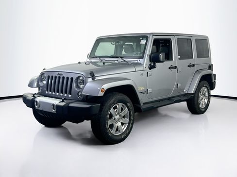 Used 2015 Jeep Wrangler Unlimited Sahara w/ Dual Top Group AWD/4WD image 1