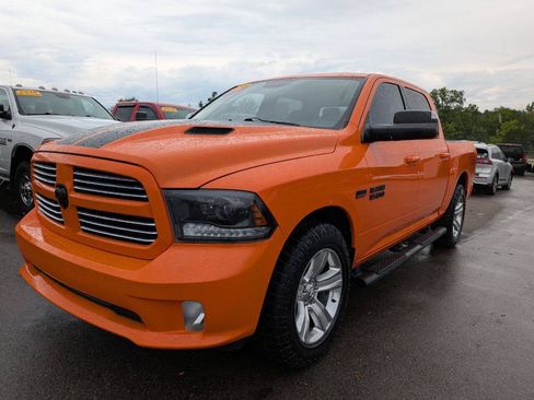 Used 2015 RAM 1500 Sport w/ Ignition Orange Sport Package AWD/4WD image 1