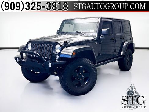 Used 2015 Jeep Wrangler Unlimited Sahara AWD/4WD image 1