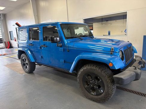 Used 2015 Jeep Wrangler Unlimited Sahara AWD/4WD image 1