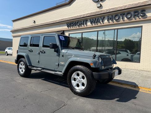 Used 2014 Jeep Wrangler Unlimited Sahara AWD/4WD image 1