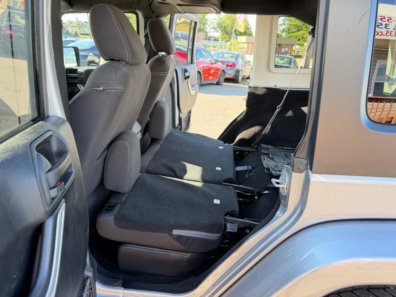 Used 2015 Jeep Wrangler Unlimited Sahara w/ Dual Top Group AWD/4WD image 37