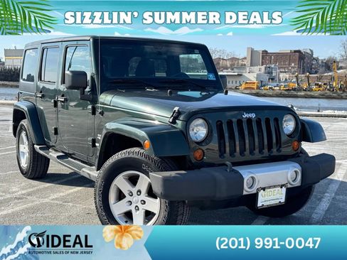 Used 2011 Jeep Wrangler Unlimited Sahara w/ Dual Top Group AWD/4WD image 1