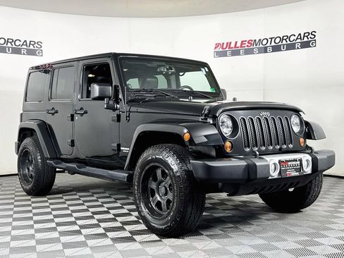 Used 2013 Jeep Wrangler Unlimited Sahara w/ Dual Top Group AWD/4WD image 1