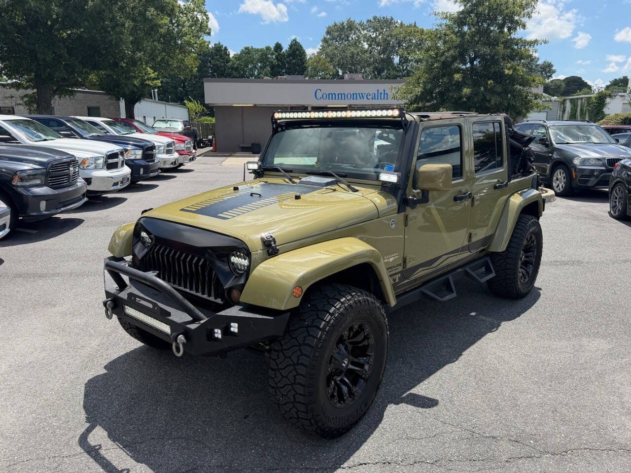 Used 2013 Jeep Wrangler Unlimited Sahara w/ Dual Top Group AWD/4WD image 2