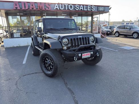 Used 2018 Jeep Wrangler Unlimited Sport w/ Mopar Black Appearance Group AWD/4WD image 1