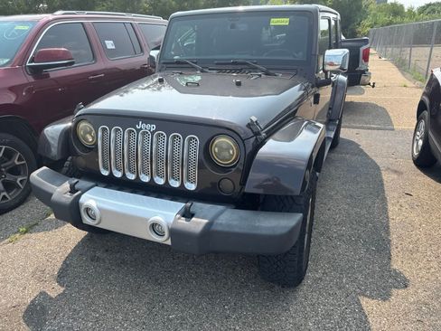Used 2013 Jeep Wrangler Unlimited Sahara w/ Connectivity Group AWD/4WD image 1