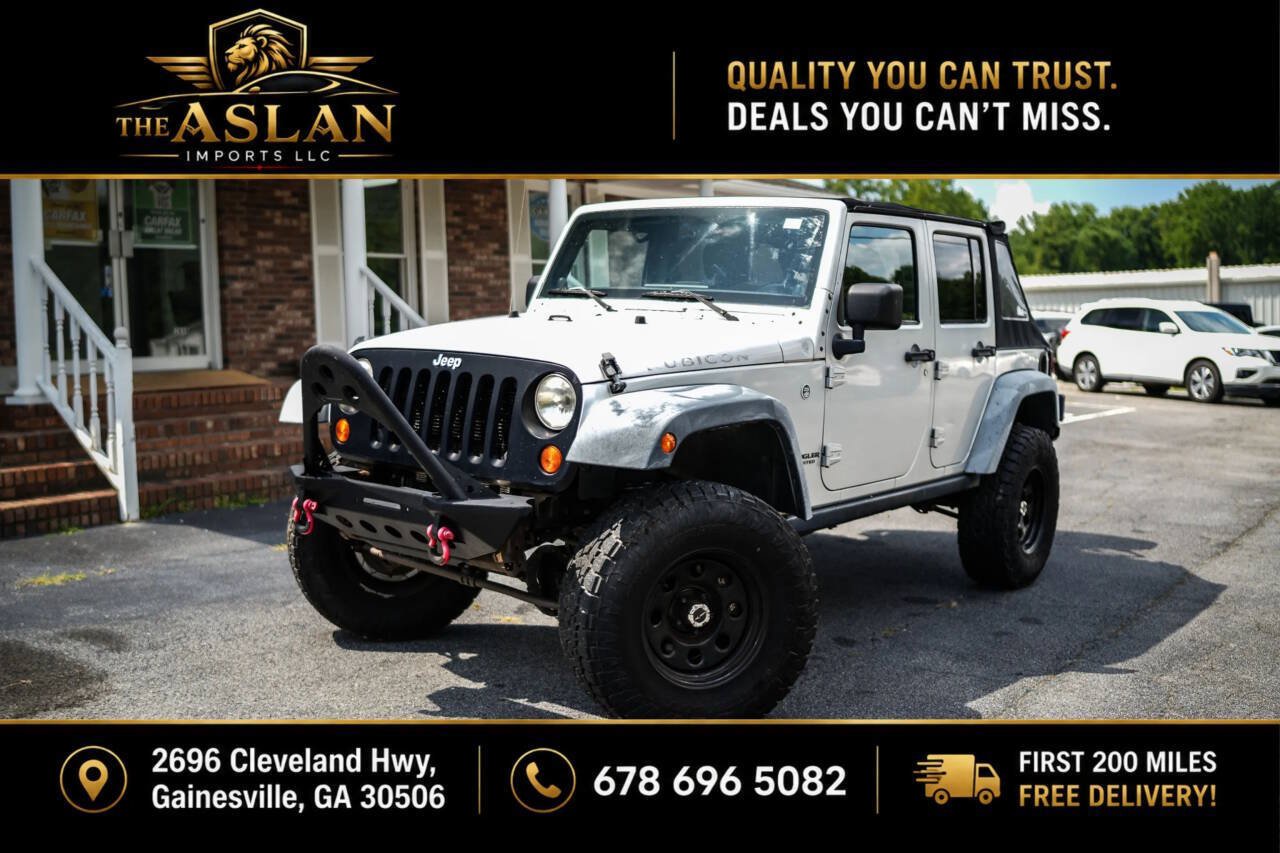 Used 2012 Jeep Wrangler Unlimited Rubicon w/ Dual Top Group AWD/4WD image 1