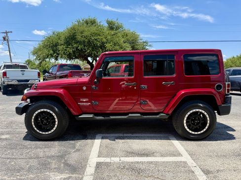 Used 2012 Jeep Wrangler Unlimited Sahara w/ Dual Top Group AWD/4WD image 6