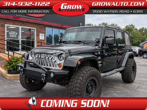 Used 2013 Jeep Wrangler Unlimited Sahara w/ Dual Top Group AWD/4WD image 1