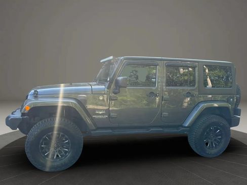 Used 2014 Jeep Wrangler Unlimited Sahara w/ Dual Top Group AWD/4WD image 10